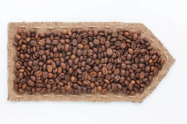 Arrow made of burlap with coffee beans. — Stock Photo, Image