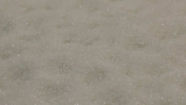 Rotatie van de achtergrond van de kristallen van suiker. Close-up — Stockvideo