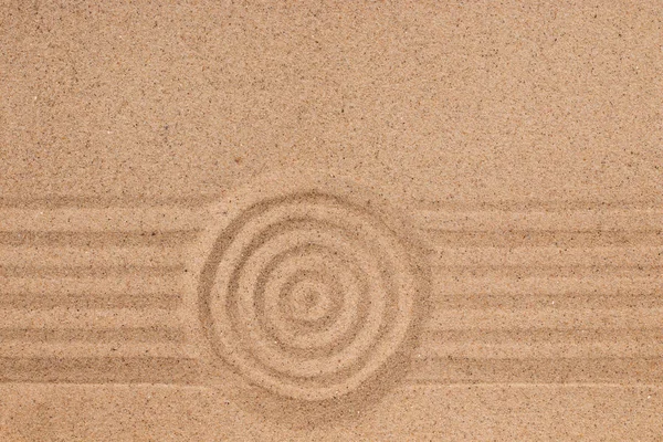 Cerchio concentrico e linee sulla sabbia. Texture di sabbia . — Foto Stock