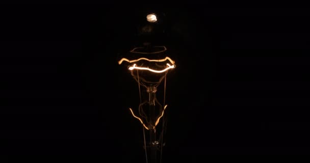 Beautiful texture of an incandescent lamp illuminated by a spotlight. — Stock Video