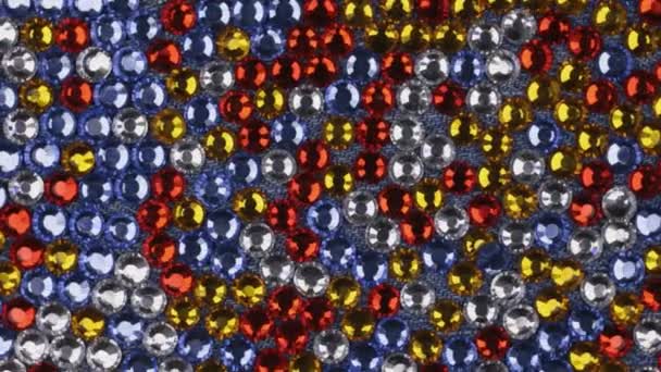 Rotation, multicolored abstract background of rhinestones. — Stock Video