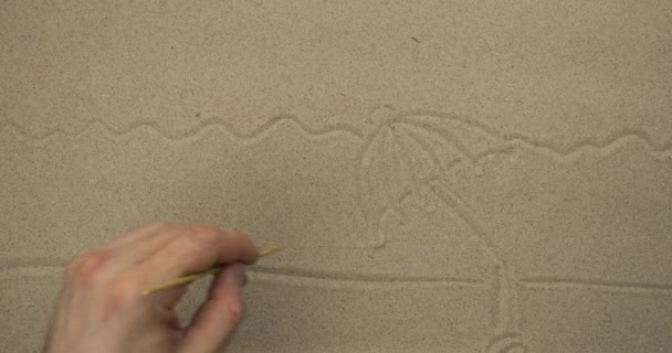 Ik teken in het zand in real time. Strandtekening voor vrijetijdsbesteding en reisreclame. — Stockvideo