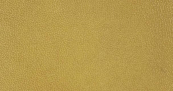 Slow rotation of yellow genuine leather. View from above. — Stock Video