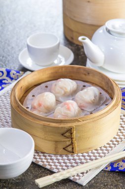 closeup of dim sum in  bamboo steamer 