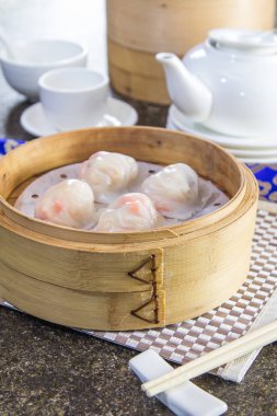 closeup of dim sum in  bamboo steamer 