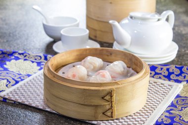 closeup of dim sum in  bamboo steamer 