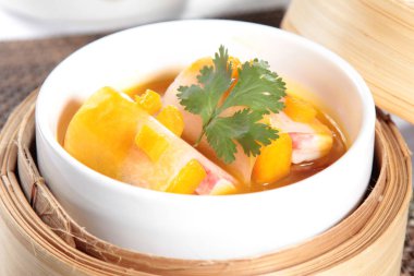 closeup of dim sum in  bamboo steamer 