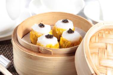 closeup of steamed buns bamboo steamer - dim sum