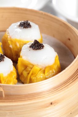 closeup of steamed buns bamboo steamer - dim sum