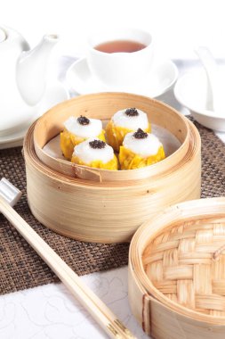 closeup of steamed buns bamboo steamer - dim sum