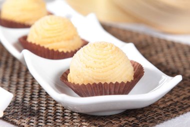 homemade vanilla muffins with chocolate cream and caramel on white plate