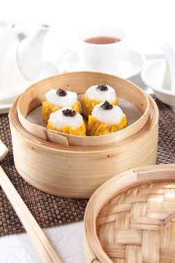 closeup of steamed buns bamboo steamer - dim sum