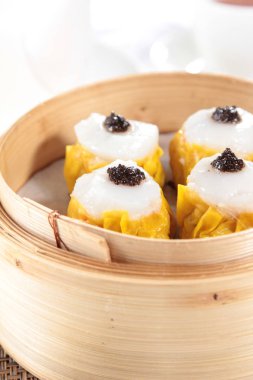 closeup of steamed buns bamboo steamer - dim sum