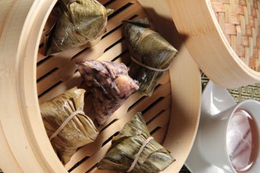 closeup of dim sum in  bamboo steamer 