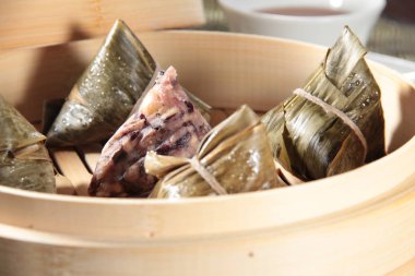 closeup of dim sum in  bamboo steamer 