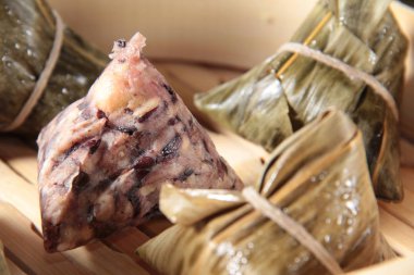 closeup of dim sum in  bamboo steamer 