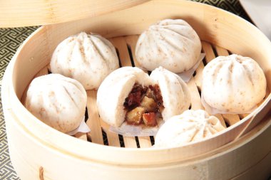closeup of steamed buns bamboo steamer - dim sum