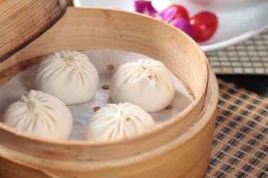 closeup of steamed buns bamboo steamer - dim sum