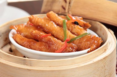 closeup of dim sum in  bamboo steamer 