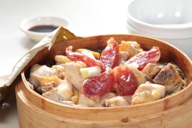 closeup of dim sum in  bamboo steamer 