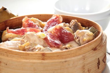 closeup of dim sum in  bamboo steamer 