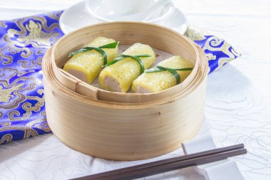 closeup of dim sum in  bamboo steamer 