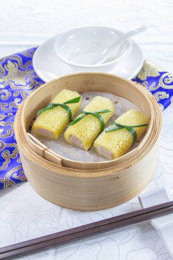closeup of dim sum in  bamboo steamer 