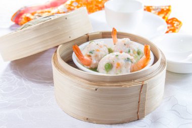 closeup of dim sum in  bamboo steamer 