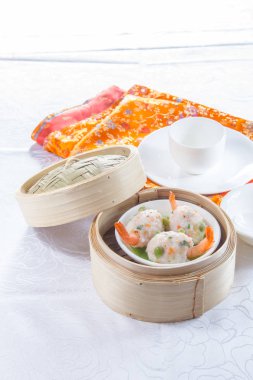 closeup of dim sum in  bamboo steamer 
