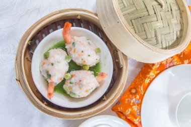 closeup of dim sum in  bamboo steamer 