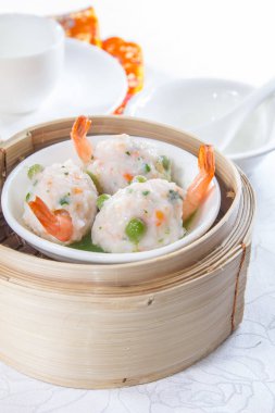 closeup of dim sum in  bamboo steamer 