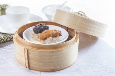 closeup of dim sum in  bamboo steamer 