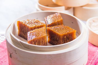 closeup of dim sum in  bamboo steamer 