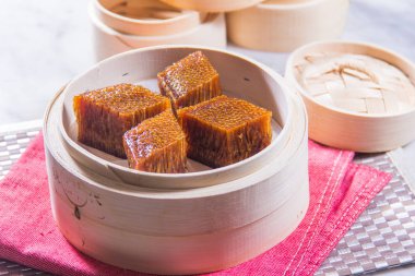 closeup of dim sum in  bamboo steamer 