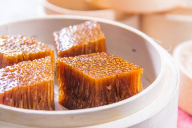closeup of dim sum in  bamboo steamer 