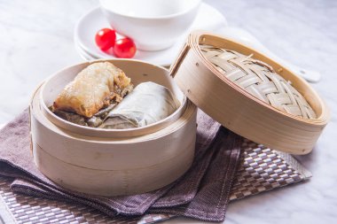 closeup of dim sum in  bamboo steamer 