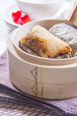 closeup of dim sum in  bamboo steamer 
