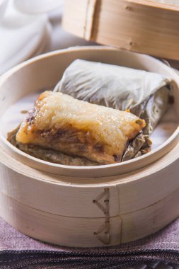 closeup of dim sum in  bamboo steamer 