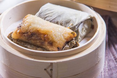 closeup of dim sum in  bamboo steamer 