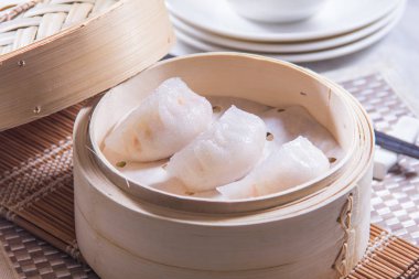 closeup of dim sum in  bamboo steamer 