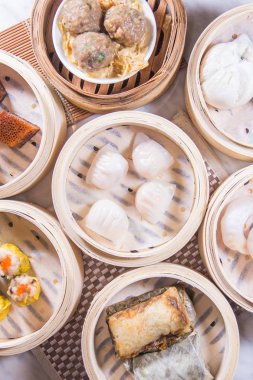 closeup of dim sum in  bamboo steamer 