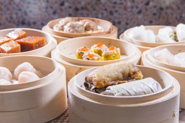 closeup of dim sum in  bamboo steamer 