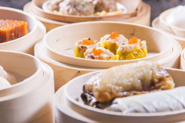 closeup of dim sum in  bamboo steamer 