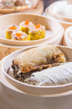 closeup of dim sum in  bamboo steamer 