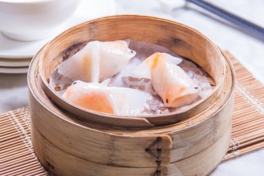 closeup of dim sum in  bamboo steamer 