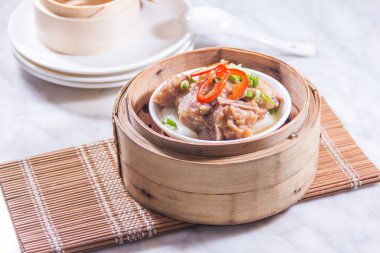 closeup of dim sum in  bamboo steamer 