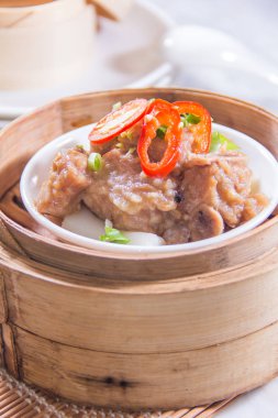 closeup of dim sum in  bamboo steamer 
