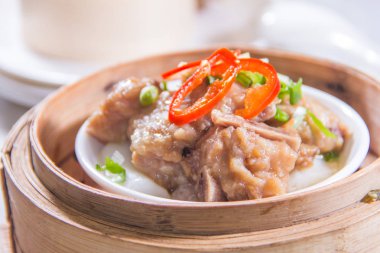 closeup of dim sum in  bamboo steamer 