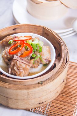 closeup of dim sum in  bamboo steamer 