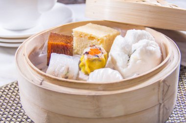 closeup of dim sum in  bamboo steamer 